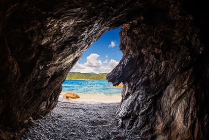 Crystal clear sea from inside a cave ( focus is on the sea )